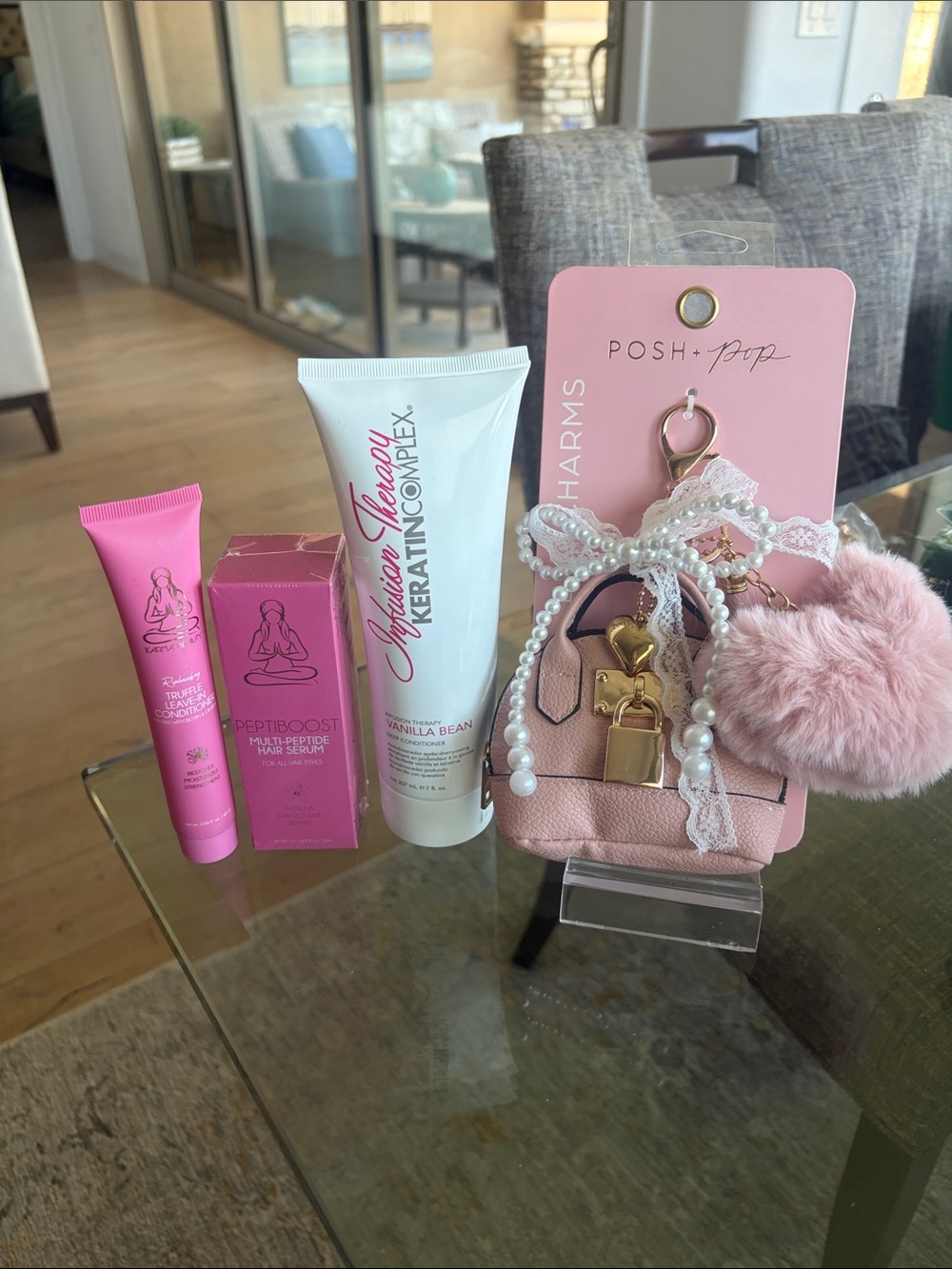 Bundle of high end hair care with adorable bag charm.